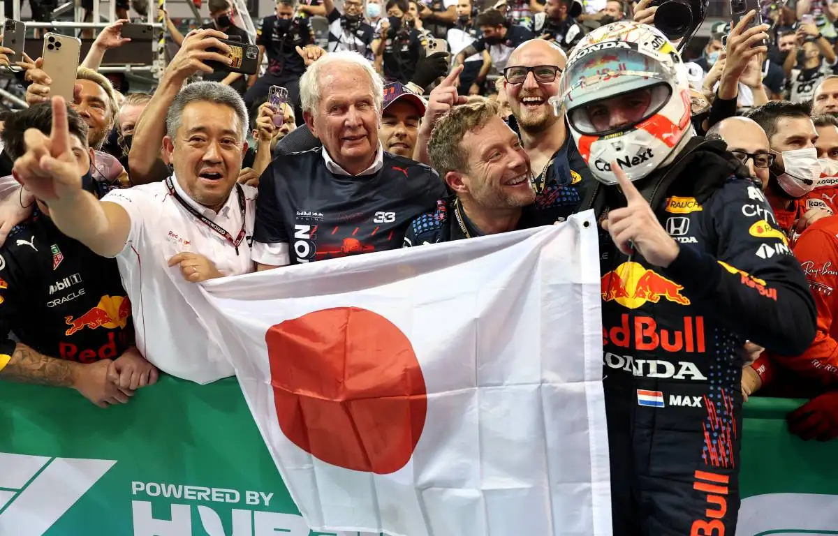 Red Bull driver Max Verstappen, Helmut Marko and Honda's Masashi Yamamoto celebrate. Abu Dhabi December 2021.