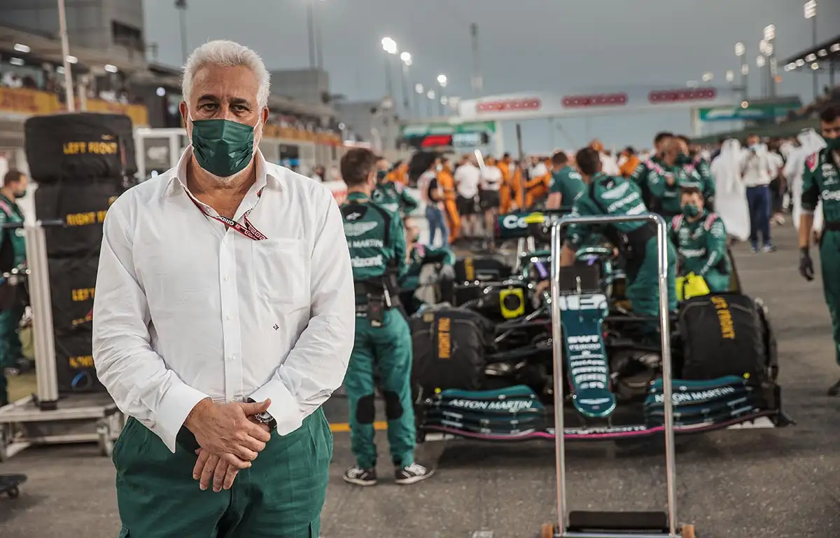 Lawrence Stroll stands in front of his son's car. Qatar November 2021