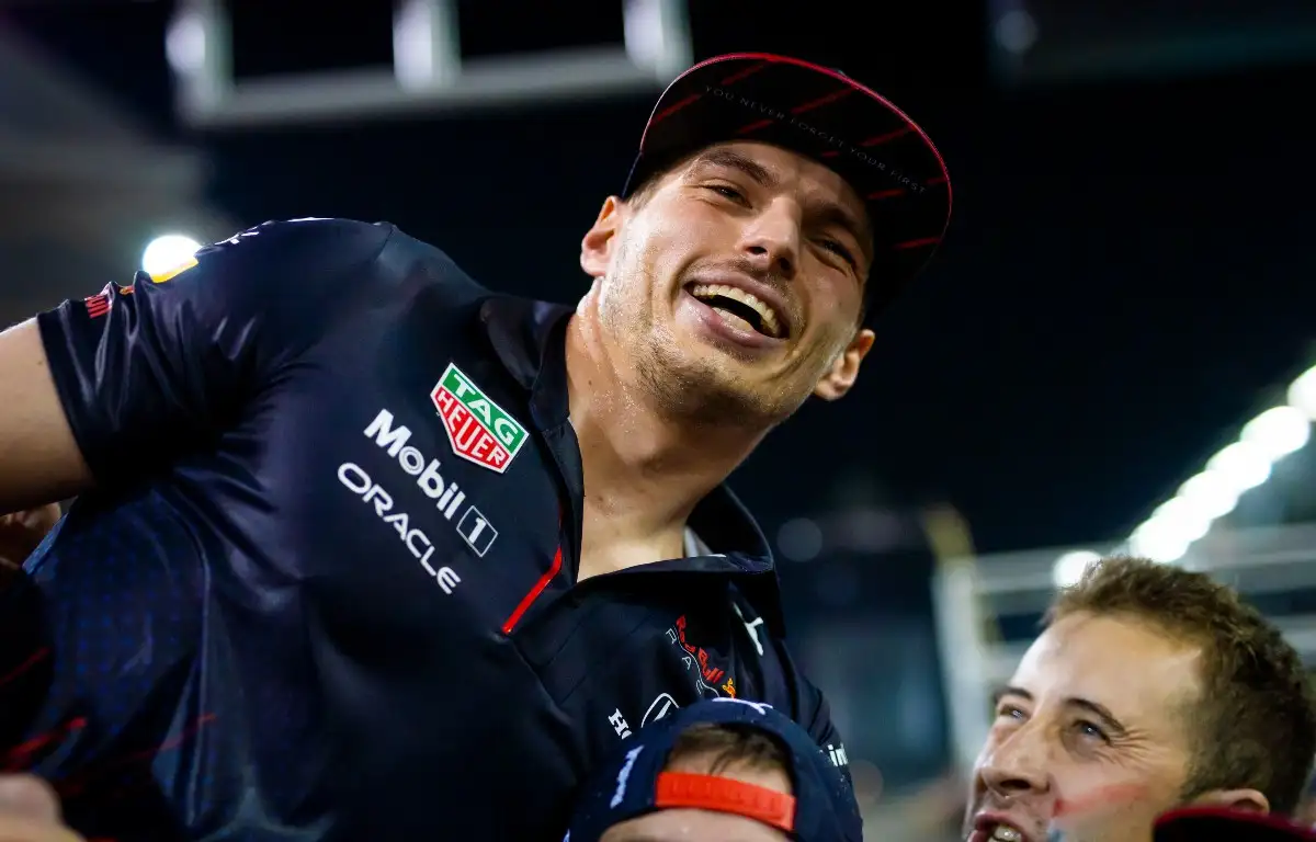 Max Verstappen smiling as he celebrates taking the 2021 title. Abu Dhabi, December 2021.