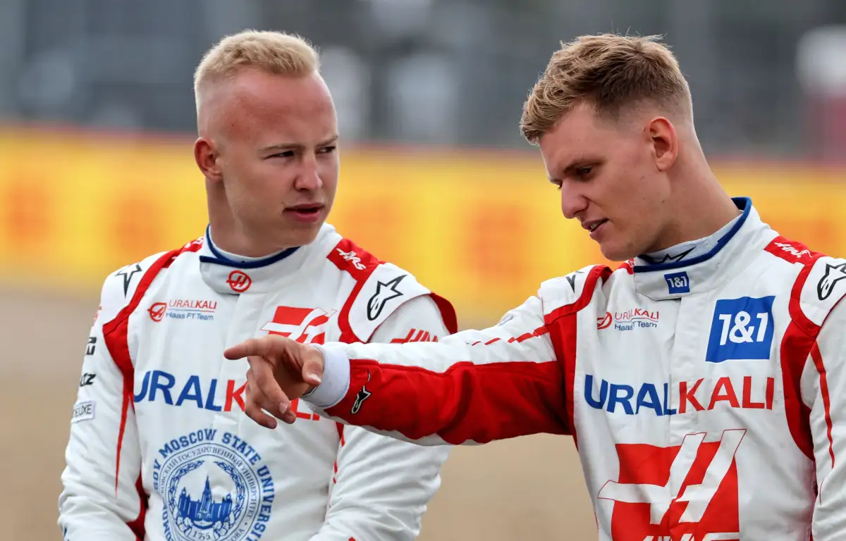 Haas driver Mick Schumacher points something out to Nikita Mazepin. Silverstone May 2021