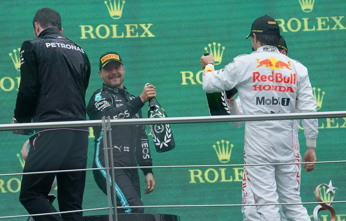 Valtteri Bottas and Sergio Perez raise bottles on the podium. Turkey, October 2021.