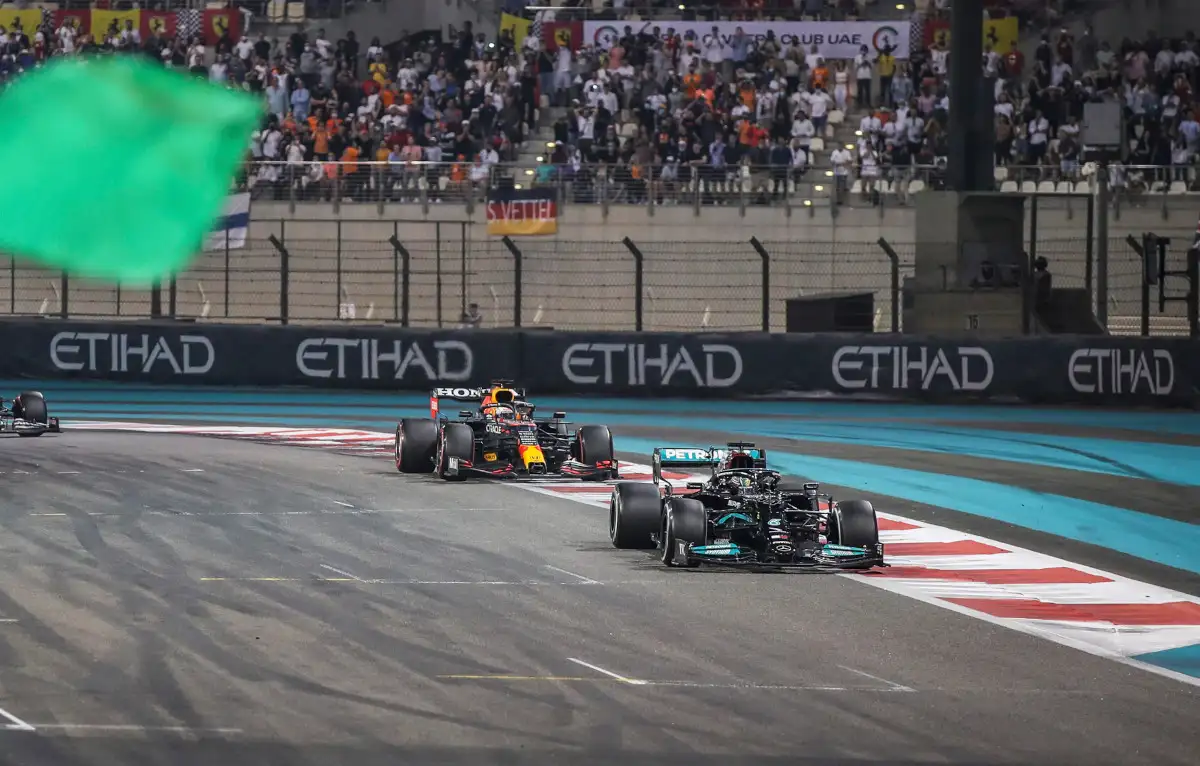 Lewis Hamilton and Max Verstappen start final lap. FIA F1 Abu Dhabi December 2021
