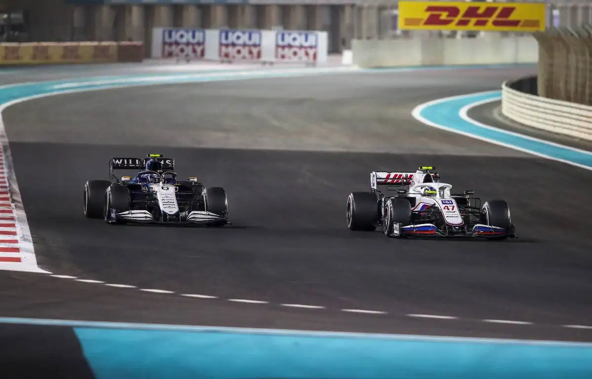 Mick Schumacher alongside Nicholas Latifi during the Abu Dhabi GP. Yas Marina December 2021.