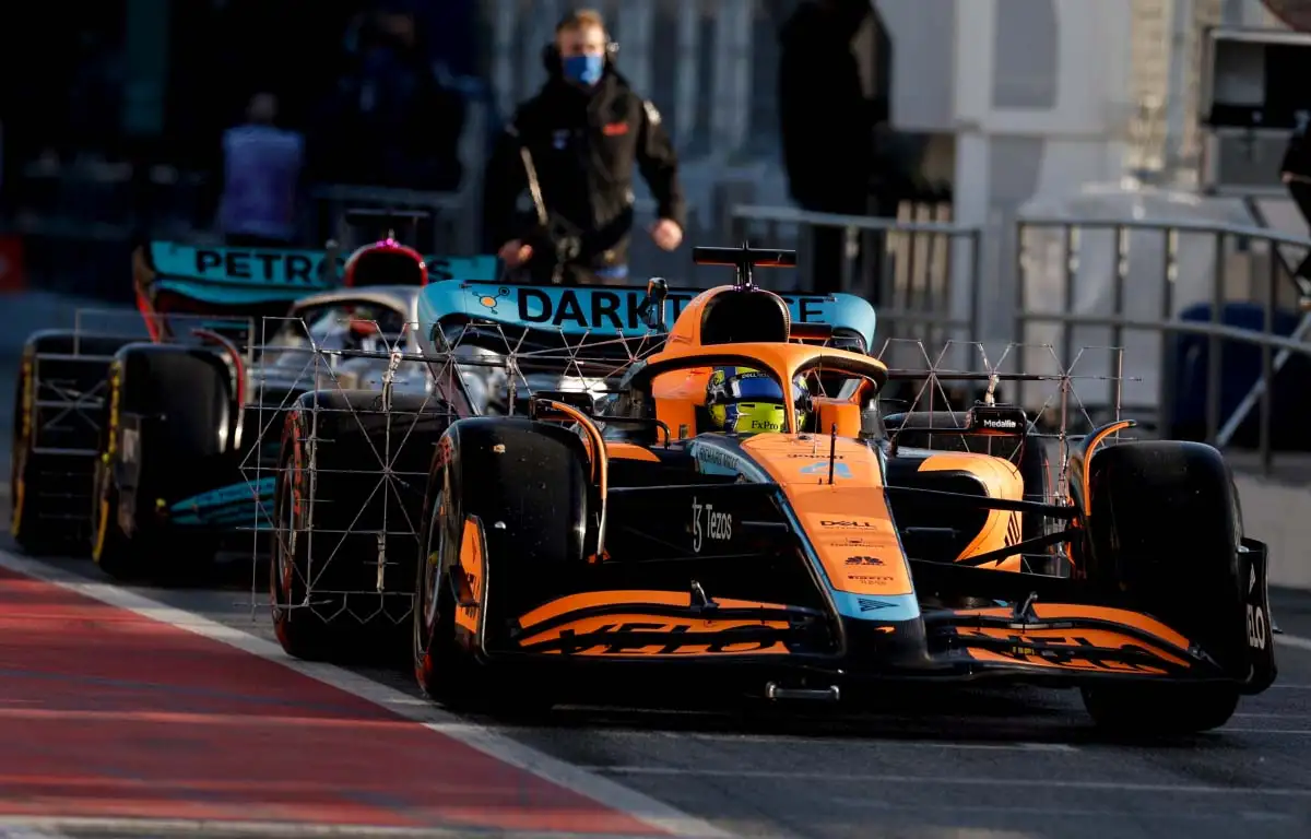 Lando Norris and Lewis Hamilton leave the pits. F1 Testing Barcelona February 2022.