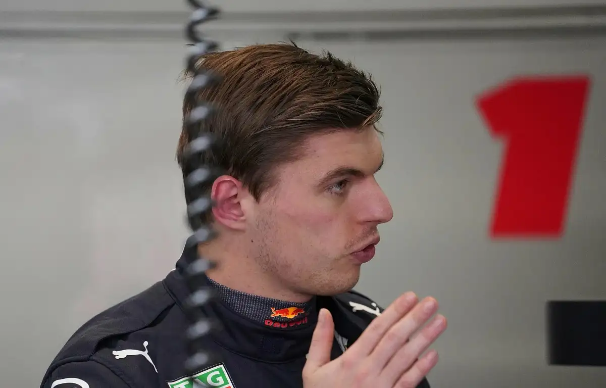 Max Verstappen talks in the Red Bull garage. Spain, February 2022.