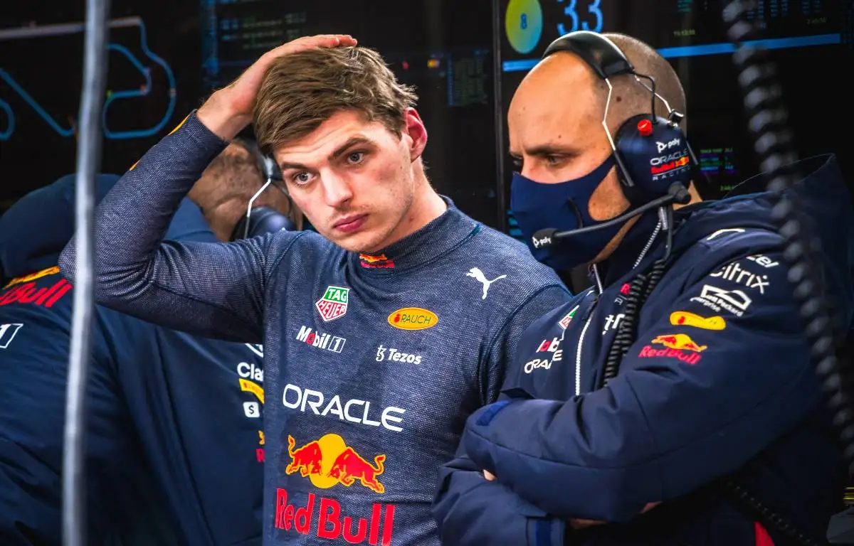 Max Verstappen puts his hand to his head. Spain, February 2022.