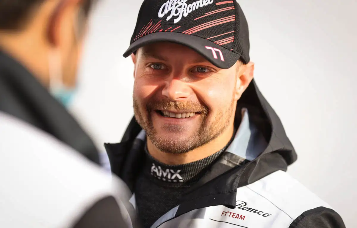 Valtteri Bottas smiles while talking. Barcelona February 2022.