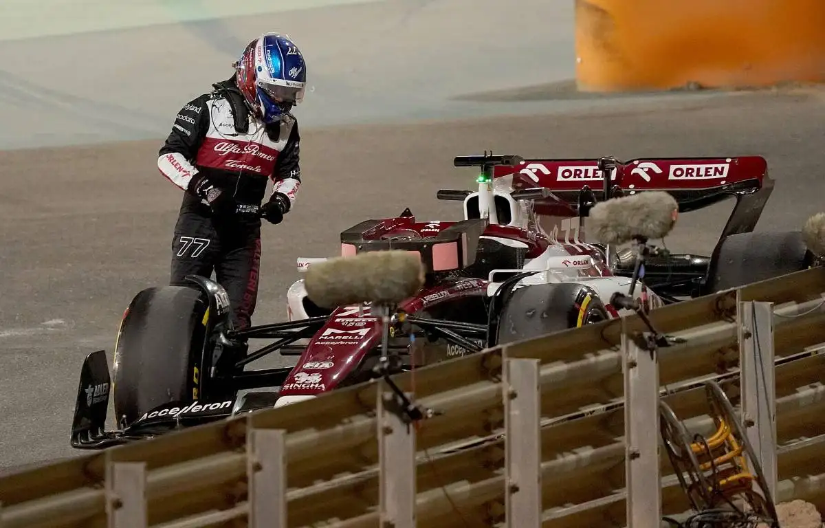 Valtteri Bottas looks at his stricken Alfa Romeo. Bahrain March 2022.