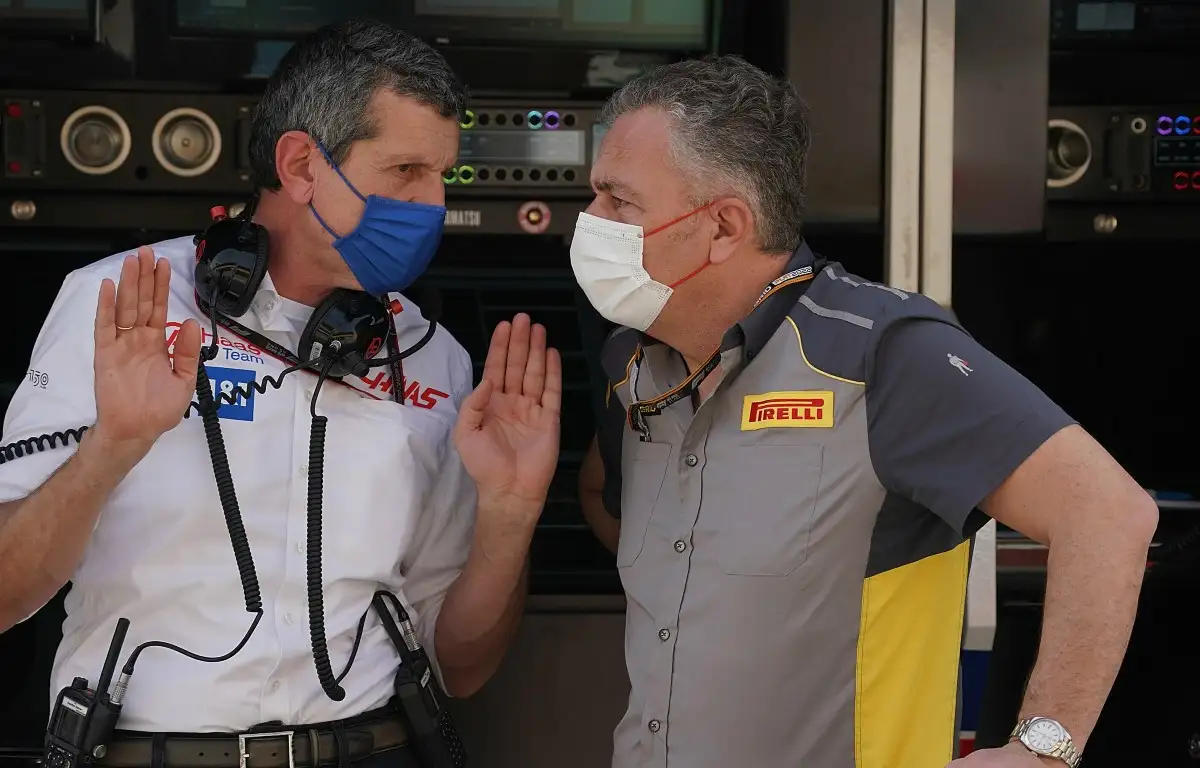 Haas' Guenther Steiner talks to Pirelli F1 boss Mario Isola. Bahrain, March 2022.