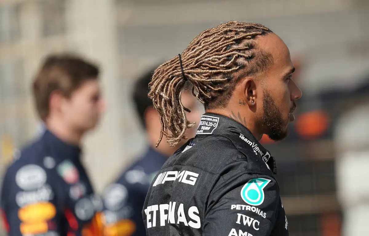 Lewis Hamilton poses for F1 photo with Max Verstappen in the background. Bahrain March 2022