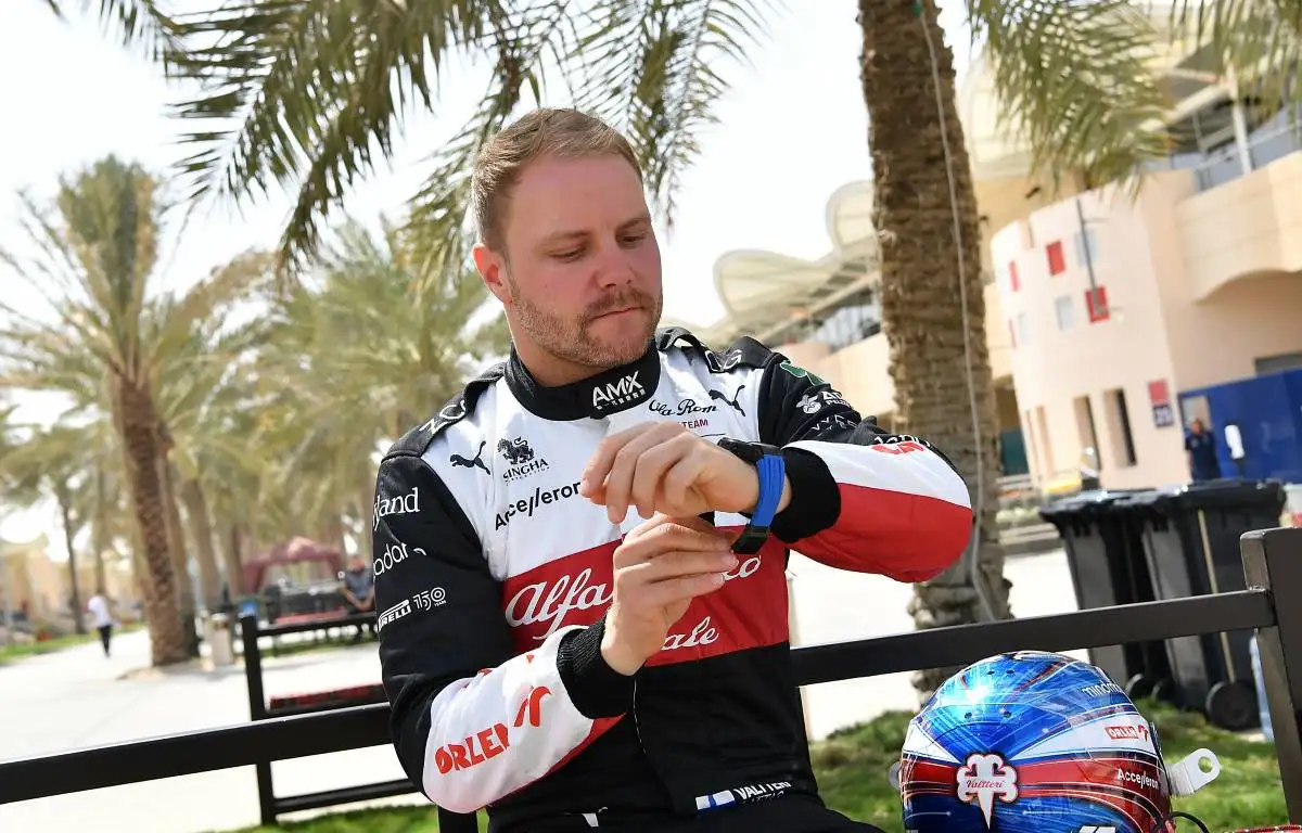 Valtteri Bottas, Alfa Romeo, adjusts his watch. Bahrain, March 2022.