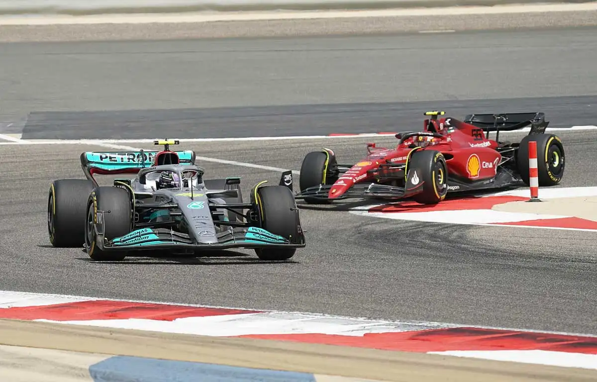 Ferrari driver Carlos Sainz tails Lewis Hamilton. Bahrain March 2022.