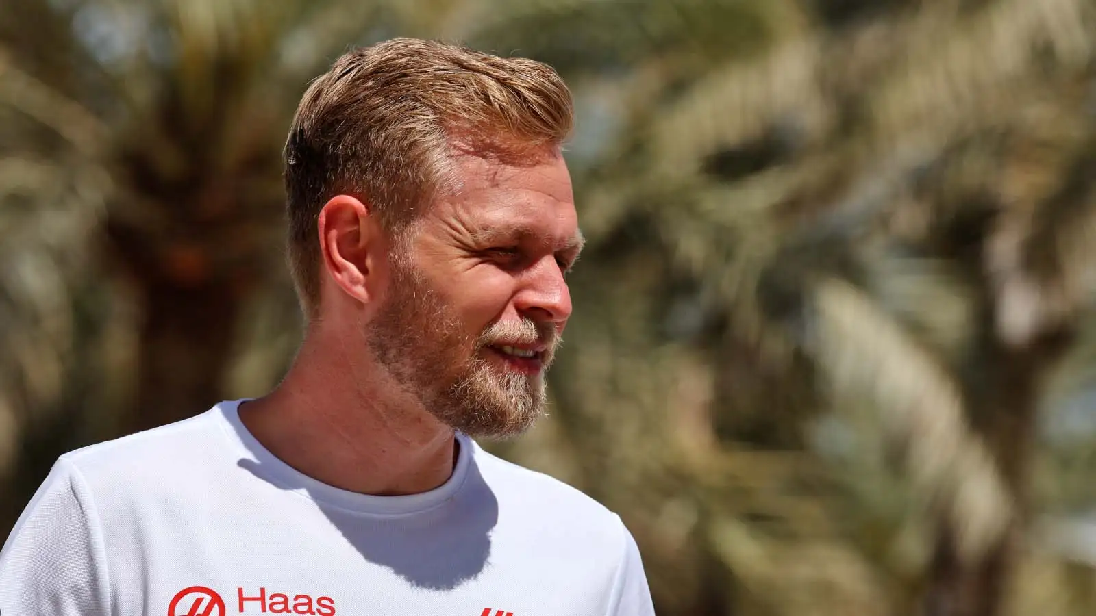 Kevin Magnussen walks through the paddock. Bahrain March 2022.