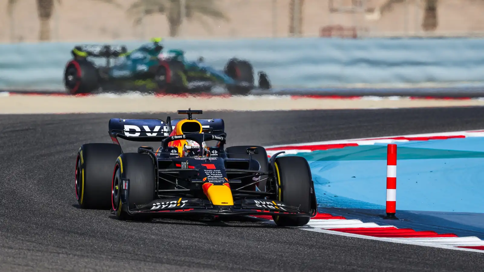 Max Verstappen leads an Aston Martin. Bahrain March 2022