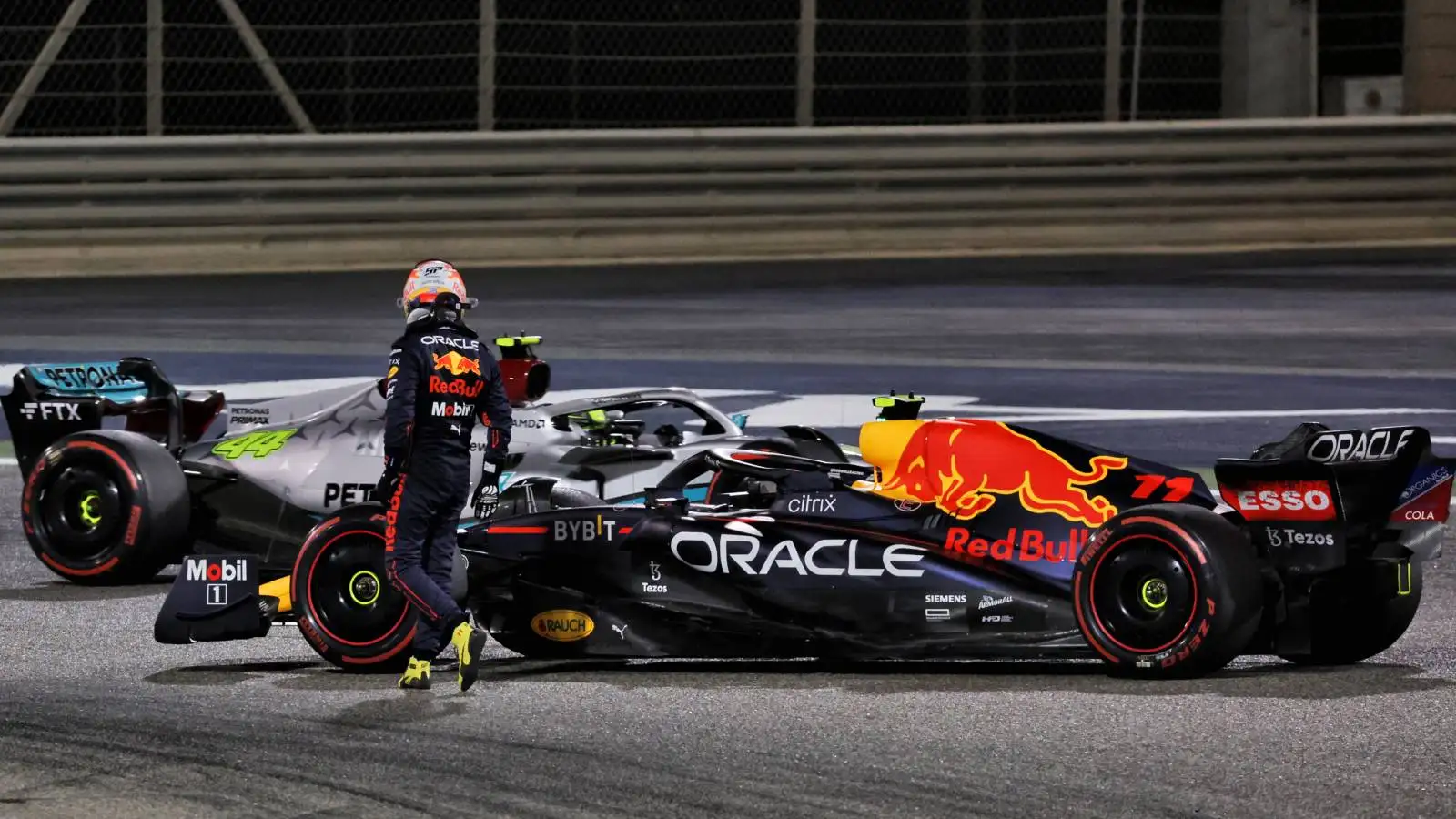 Sergio Perez walks away from his broken Red Bull. Bahrain March 2022.