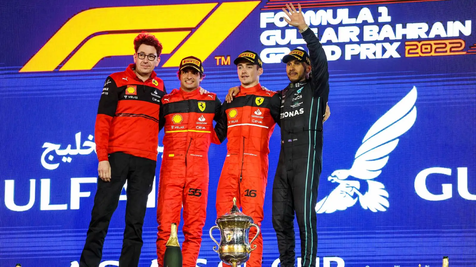 Mattia Binotto, Charles Leclerc, Carlos Sainz and Lewis Hamilton on the podium. Bahrain March 2022.