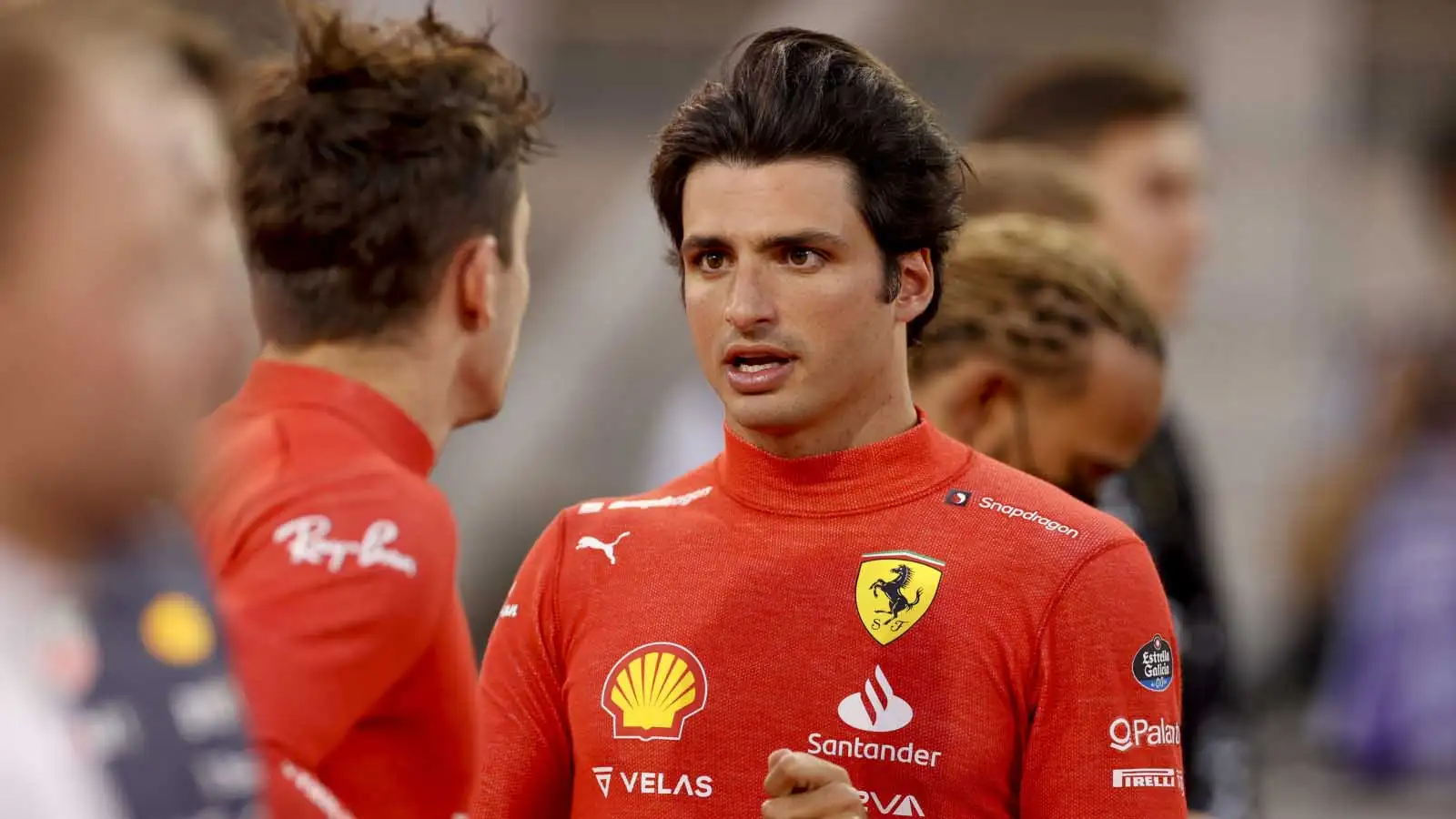 Carlos Sainz chats to Charles Leclerc on the grid. Bahrain March 2022.