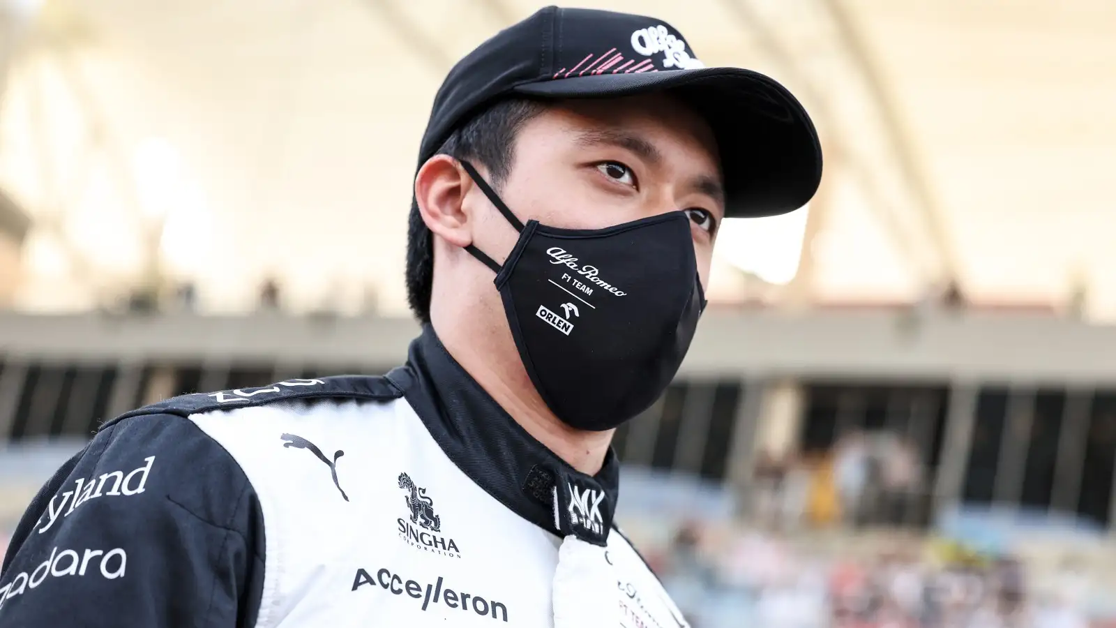 Zhou Guanyu in his Alfa Romeo race suit and mask. Bahrain, March 2022.