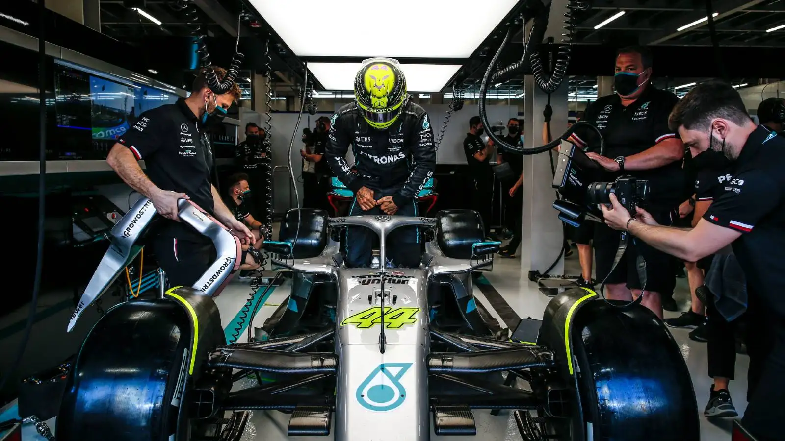 Lewis Hamilton astride his W13 car in the Mercedes garage. Jeddah March 2022.