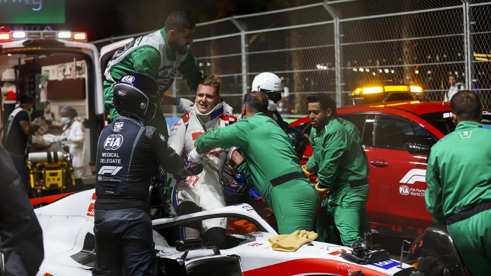 Mick Schumacher helped out of his Haas after crashing in Saudi Arabia. Jeddah March 2022.