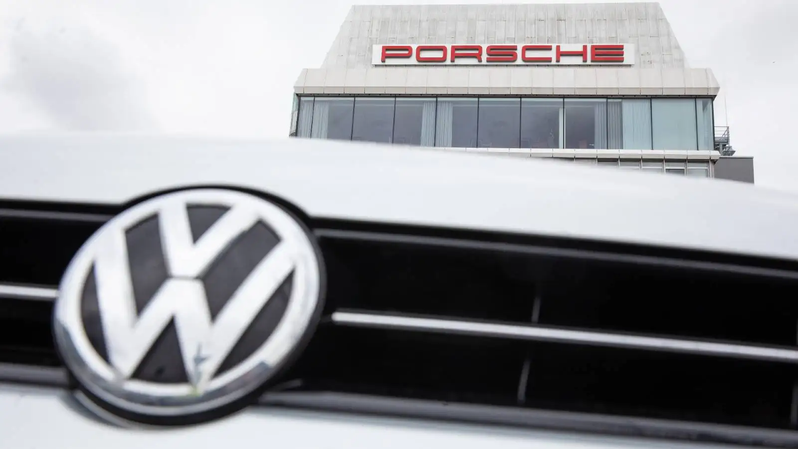 Volkswagen and Porsche logos on display. Stuttgart February 2022.