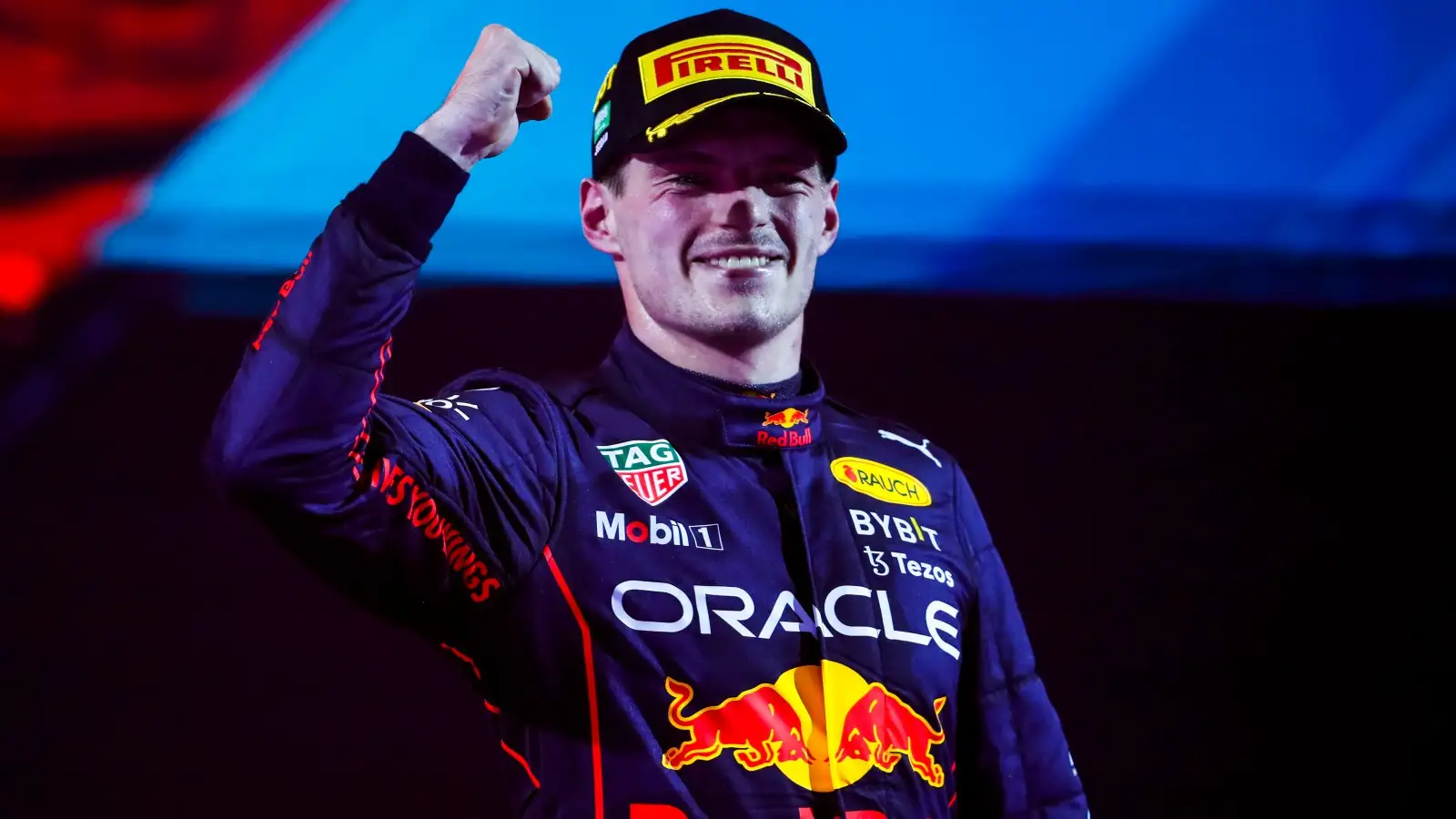 Max Verstappen, Red Bull, celebrates with his arm raised. Saudi Arabia, March 2022.