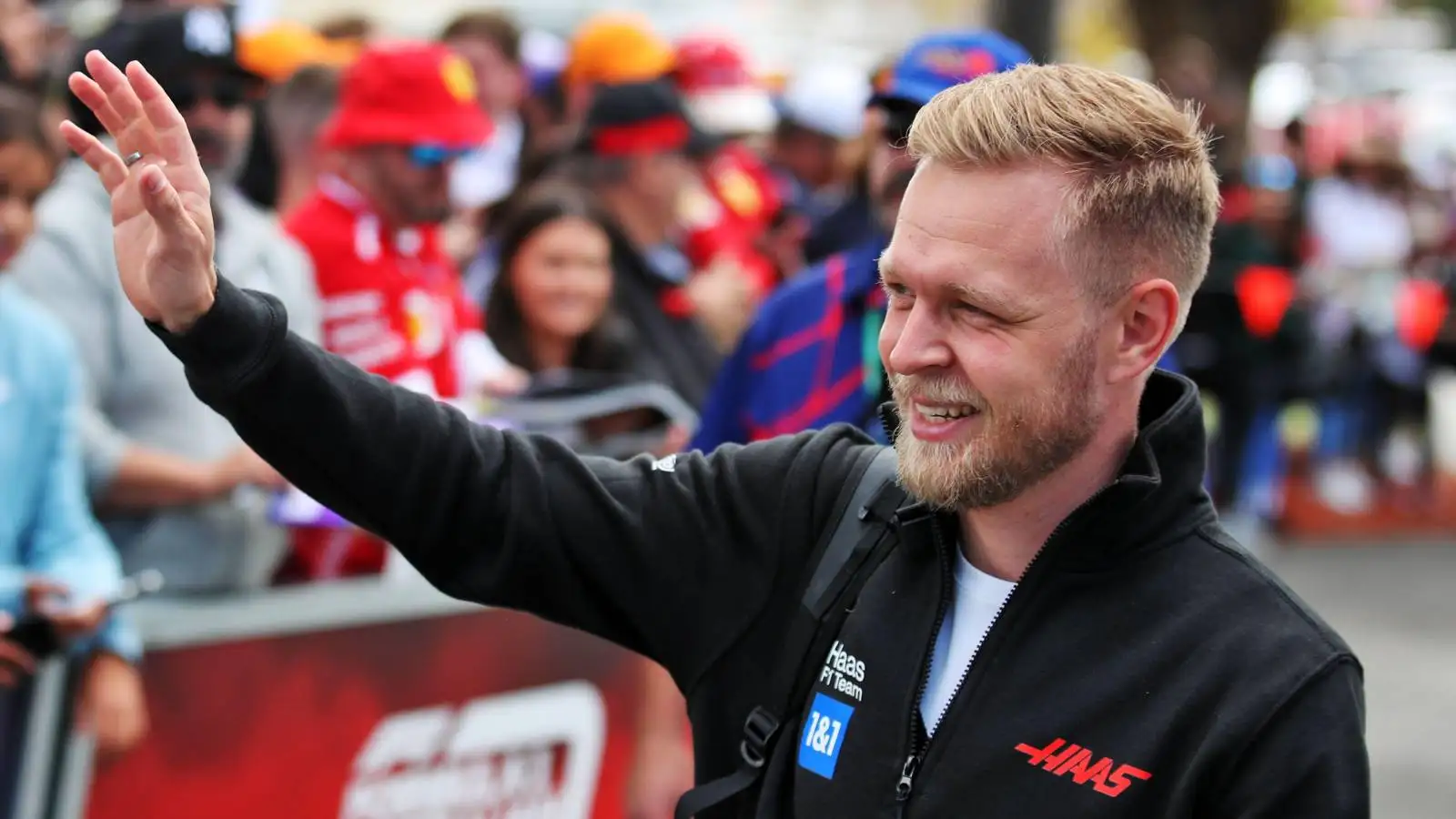 Kevin Magnussen waves to fans at the Australian GP. Melbourne April 2022.