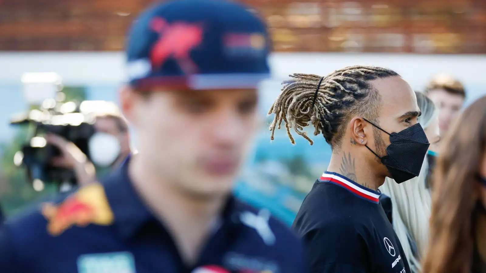Max Verstappen blurred, Lewis Hamilton is in focus. Australia, April 2022.