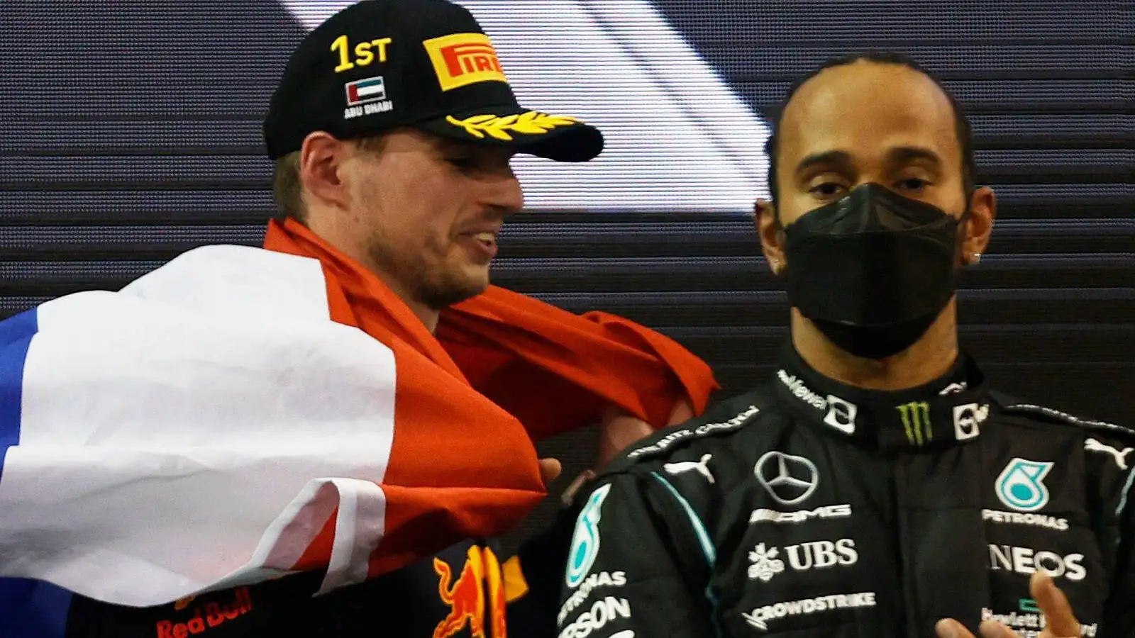 Max Verstappen and Lewis Hamilton share the podium. Abu Dhabi, December 2021.