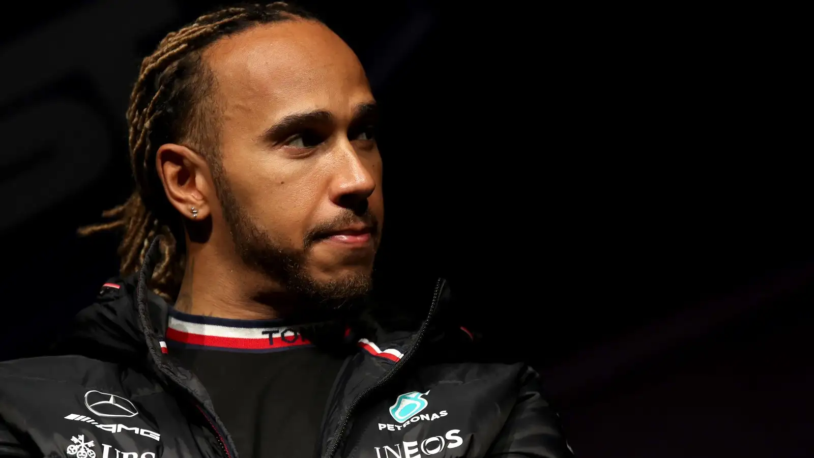 Lewis Hamilton, Mercedes, in front of a dark background. Australia, April 2022.