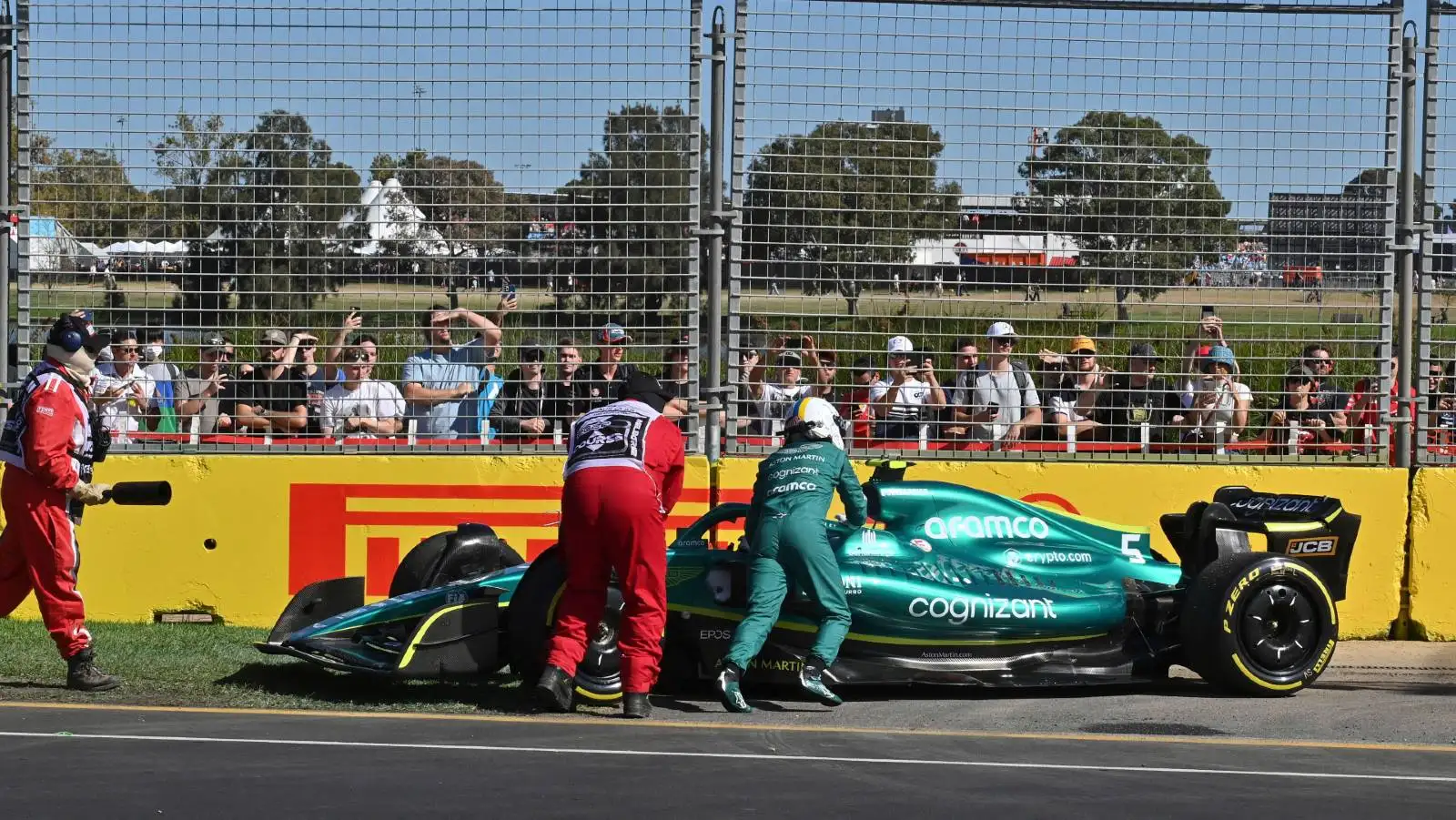 Sebastian Vettel helps to push his Aston Martin. Melbourne April 2022.
