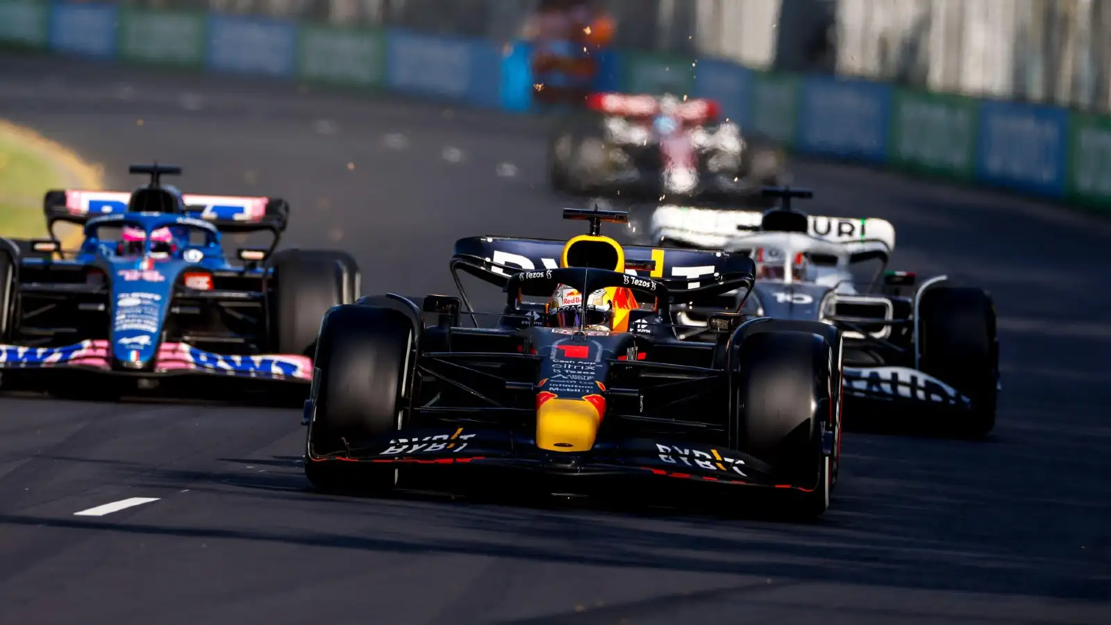 Max Verstappen's Red Bull followed by an Alpine and an AlphaTauri. Melbourne April 2022.