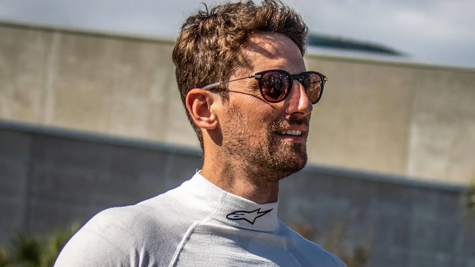 Ex F1 driver Romain Grosjean wearing sunglasses.