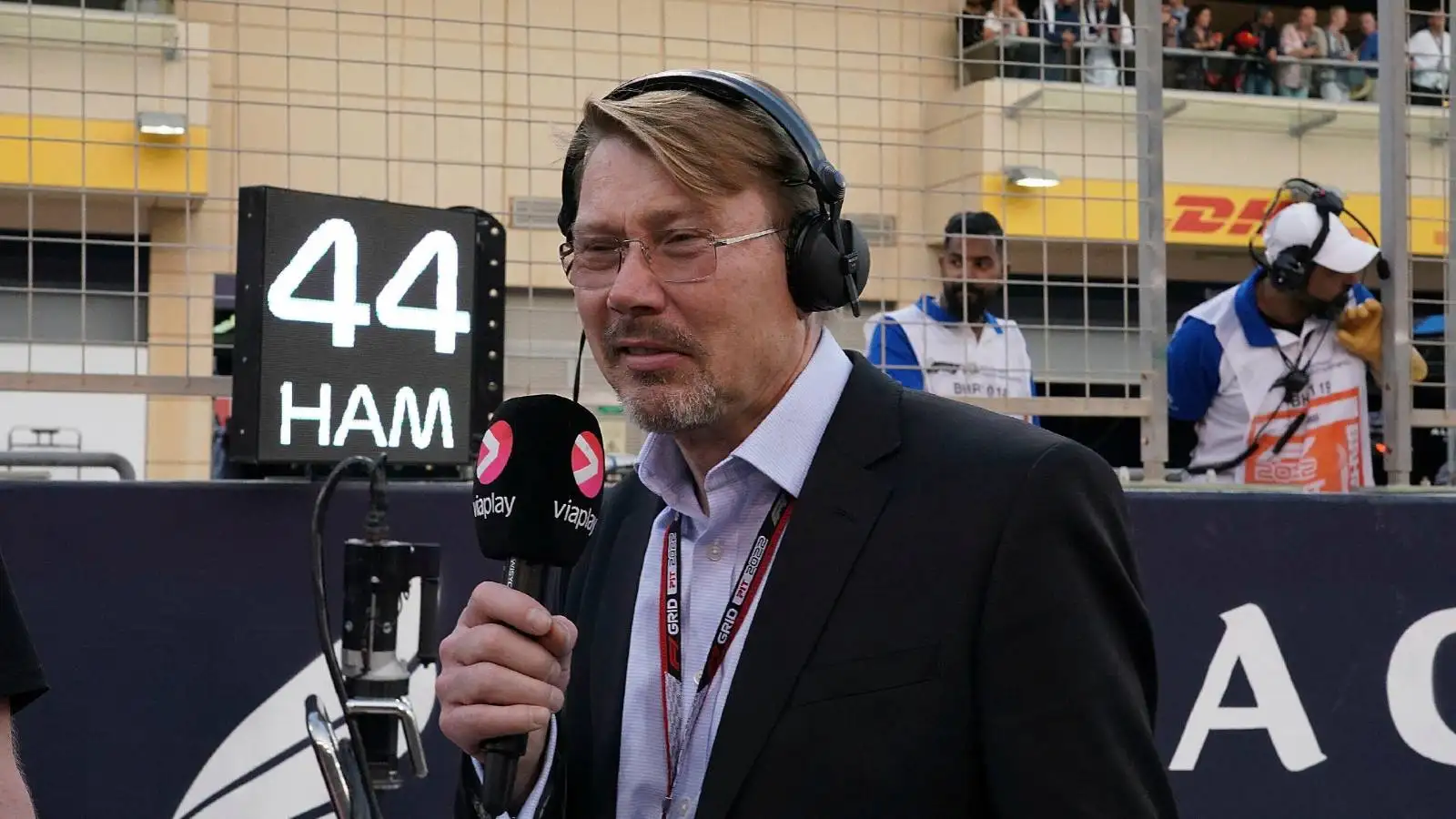 Mika Hakkinen speaking into a microphone. Bahrain March 2022.