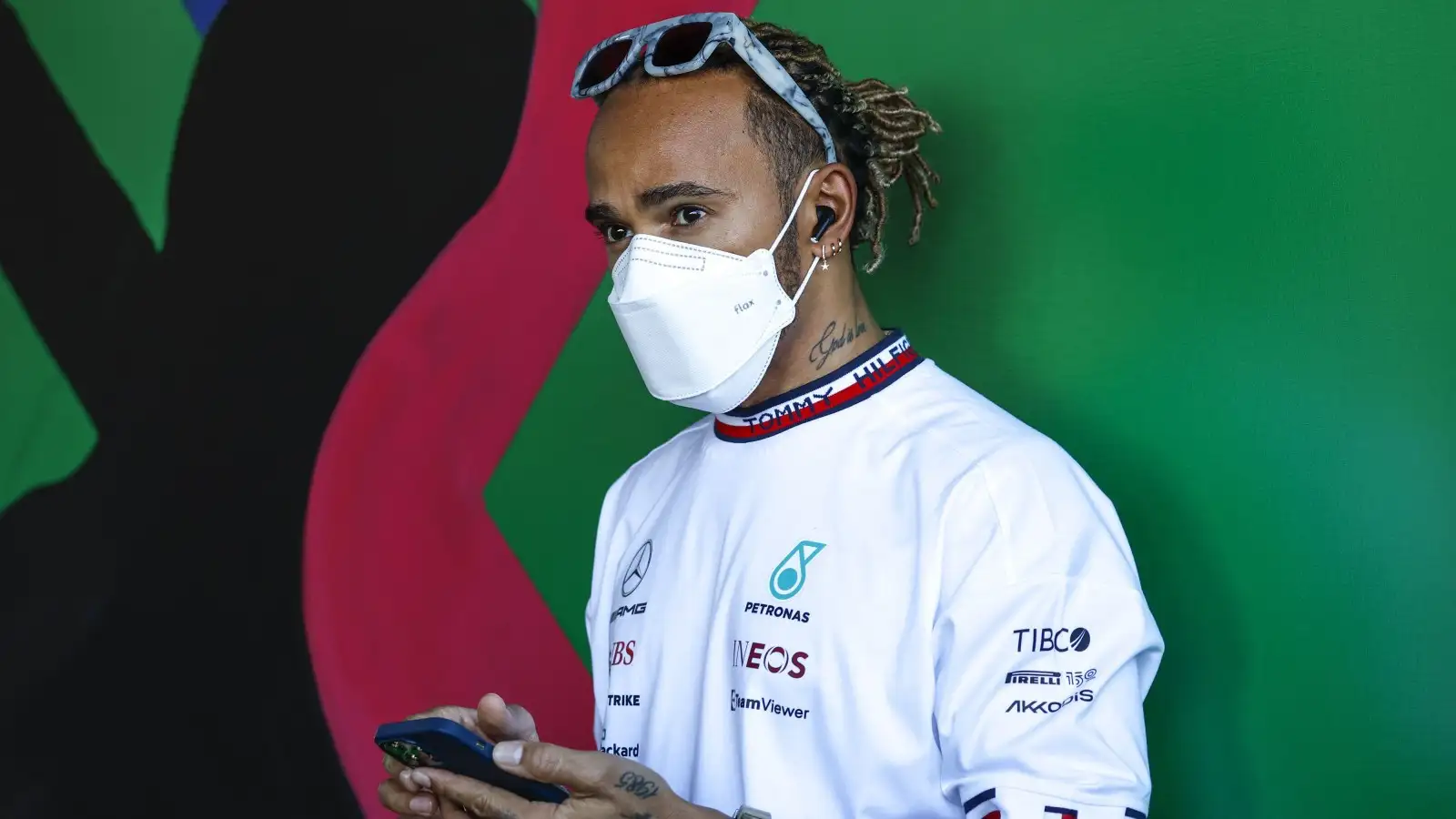 Lewis Hamilton on his phone. Melbourne, April 2022.