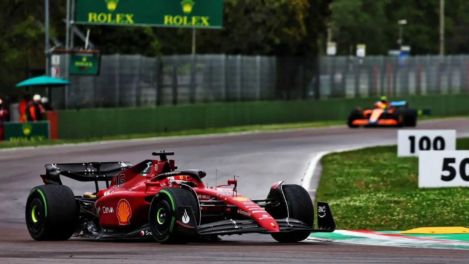 Charles Leclerc's Ferrari clear of a McLaren. Imola April 2022.