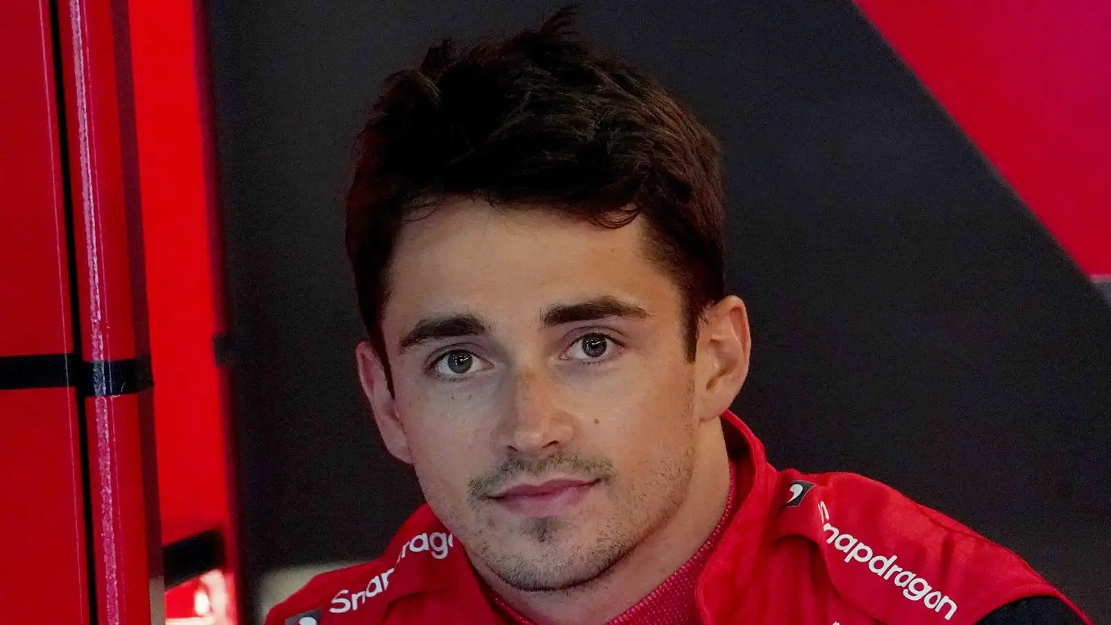 Charles Leclerc looks at the camera and smiles. Imola, April 2022.