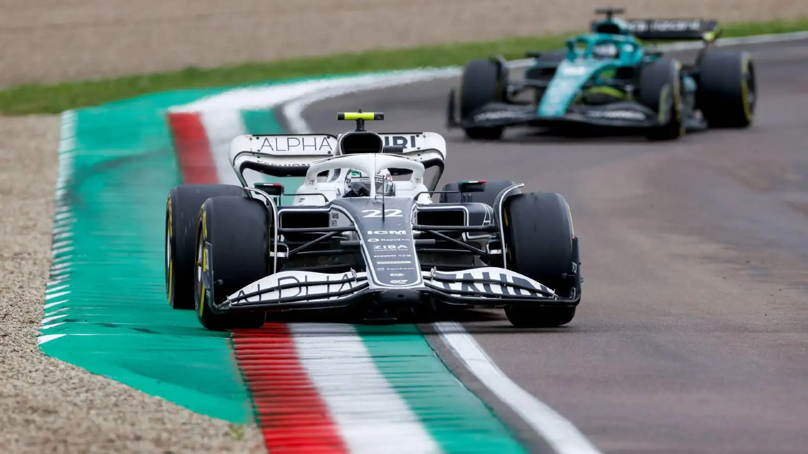 Yuki Tsunoda ahead of an Aston Martin. Imola April 2022.