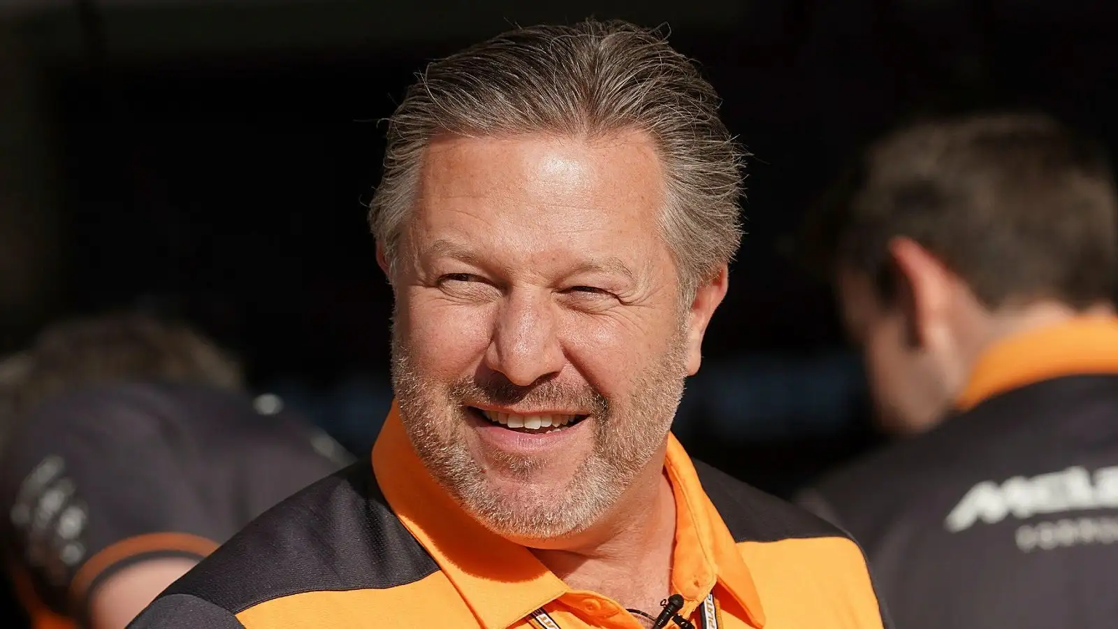 Zak Brown smiling in the sun. Sakhir, March 2022.