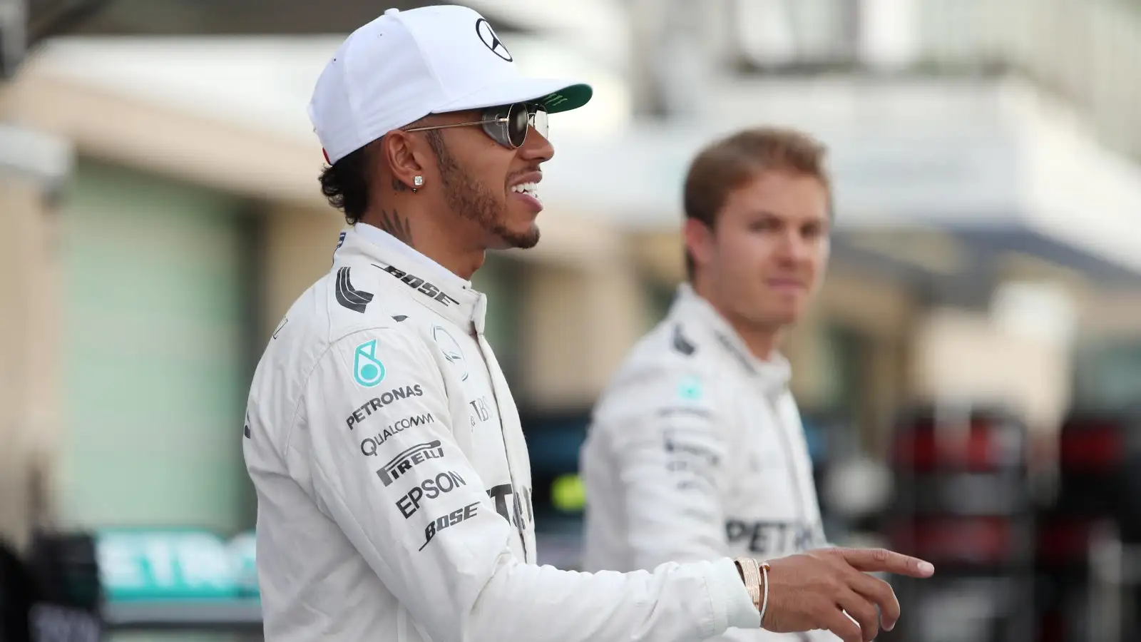 Nico Rosberg looks at then Mercedes team-mate Lewis Hamilton during a photoshoot in Abu Dhabi, 2016.