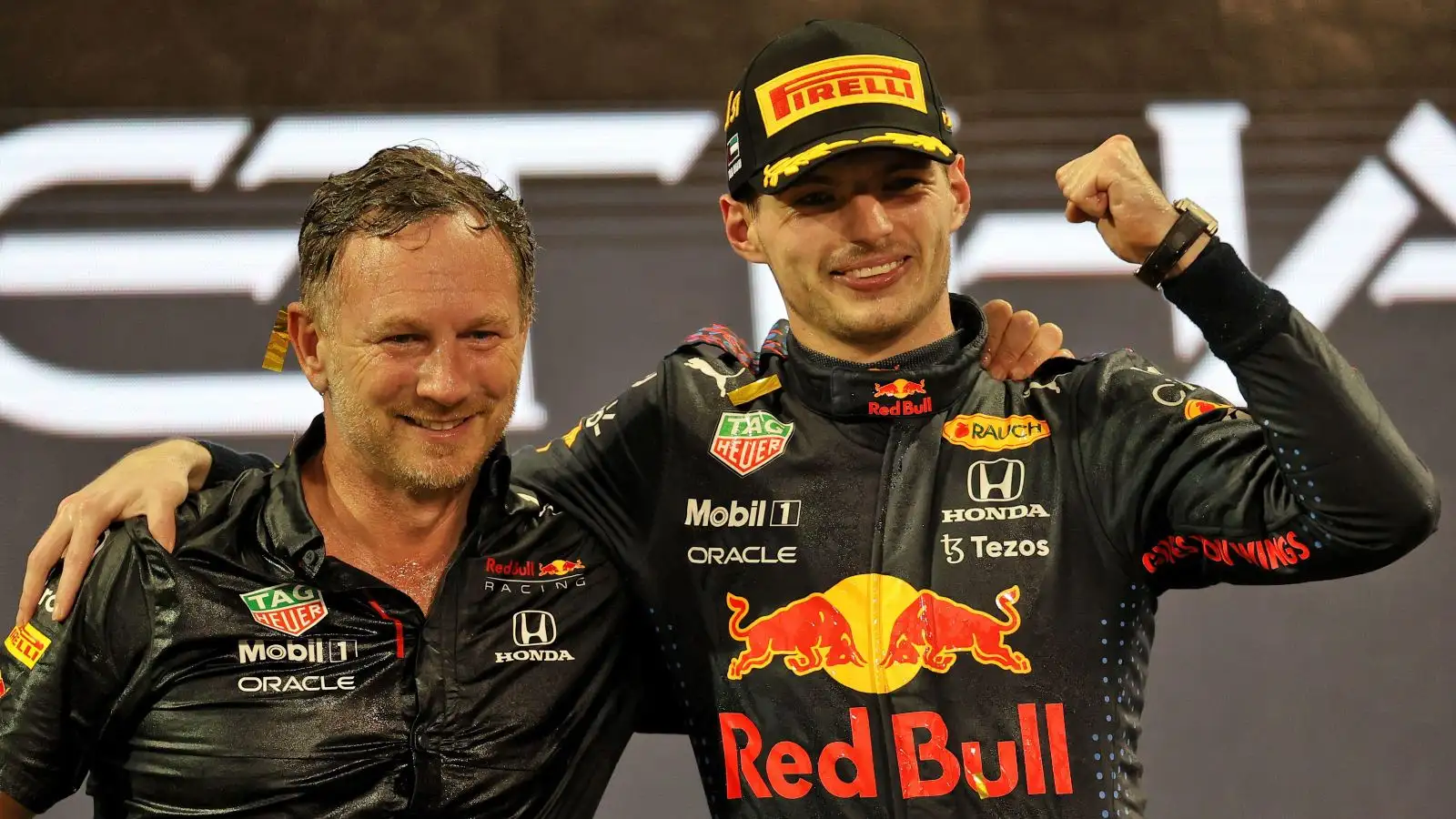 Christian Horner and Max Verstappen celebrate together. Abu Dhabi, December 2021.