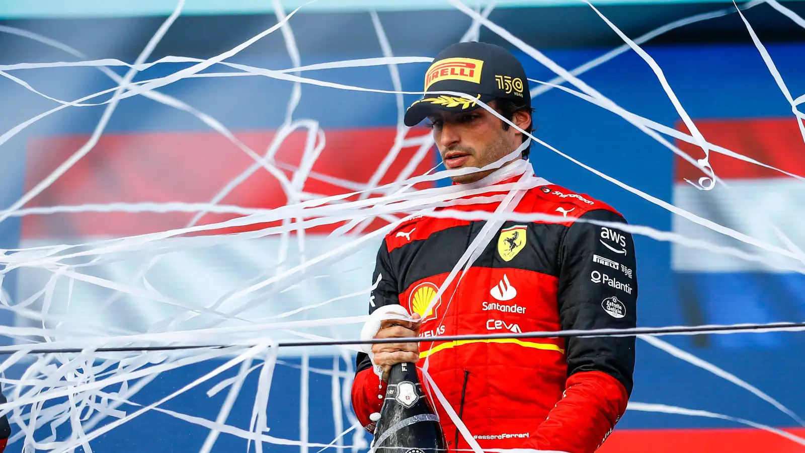 Carlos Sainz on the podium covered in streamers. Miami May 2022