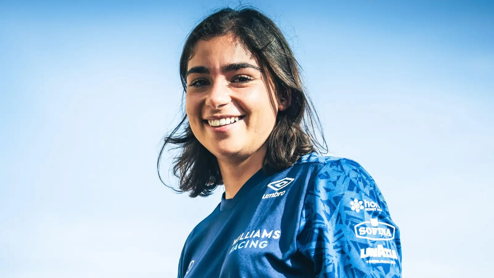 Jamie Chadwick smiles at the camera. Abu Dhabi, December 2021.