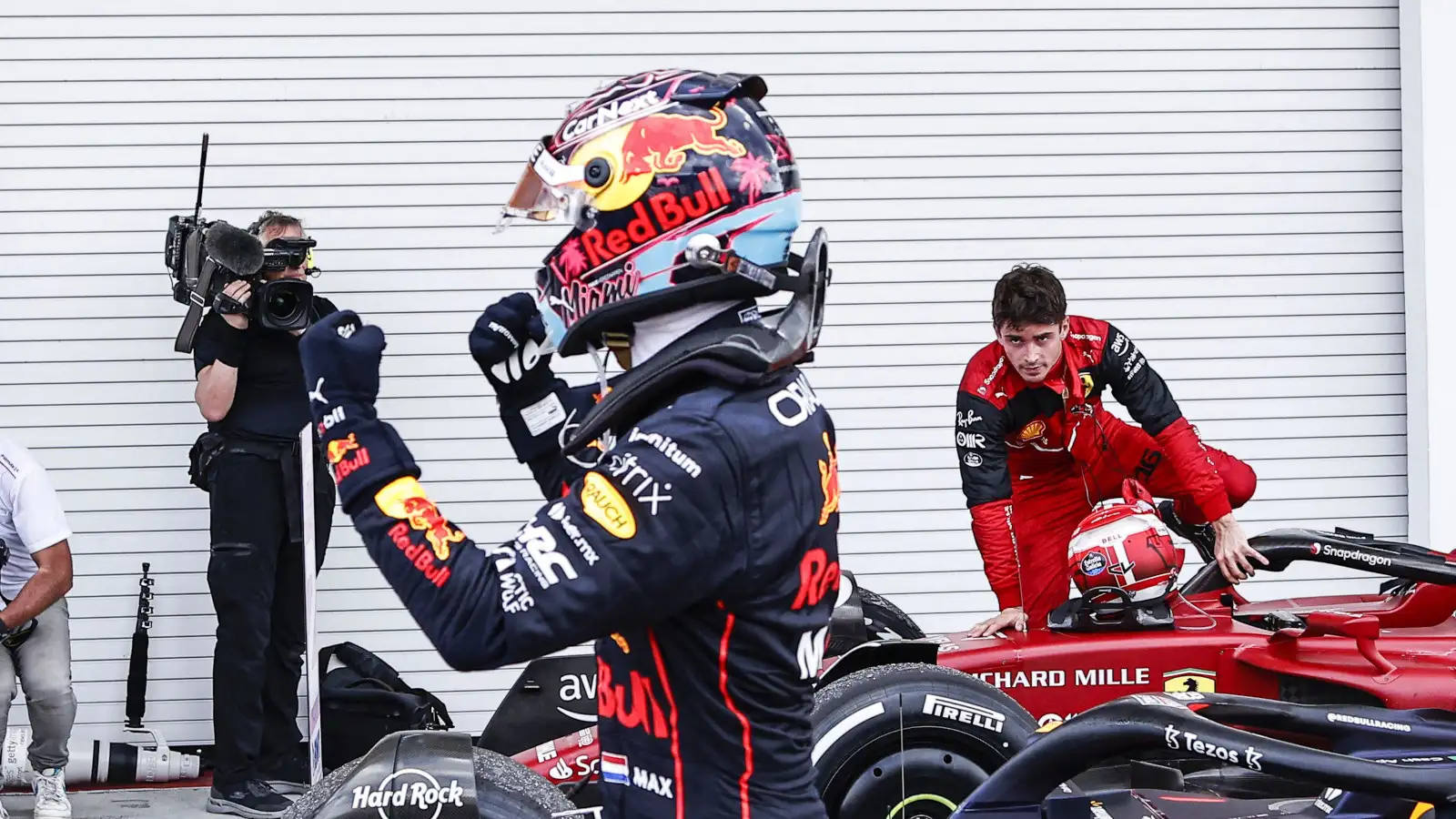 Charles Leclerc looking at Max Verstappen celebrating. Miami May 2022