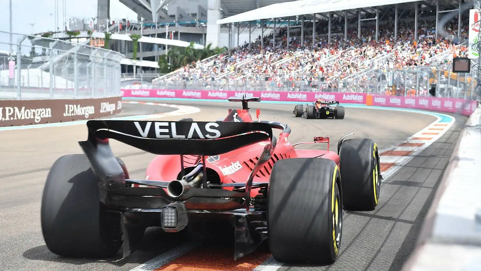 Charles Leclerc's Ferrari following a Red Bull. Miami May 2022.