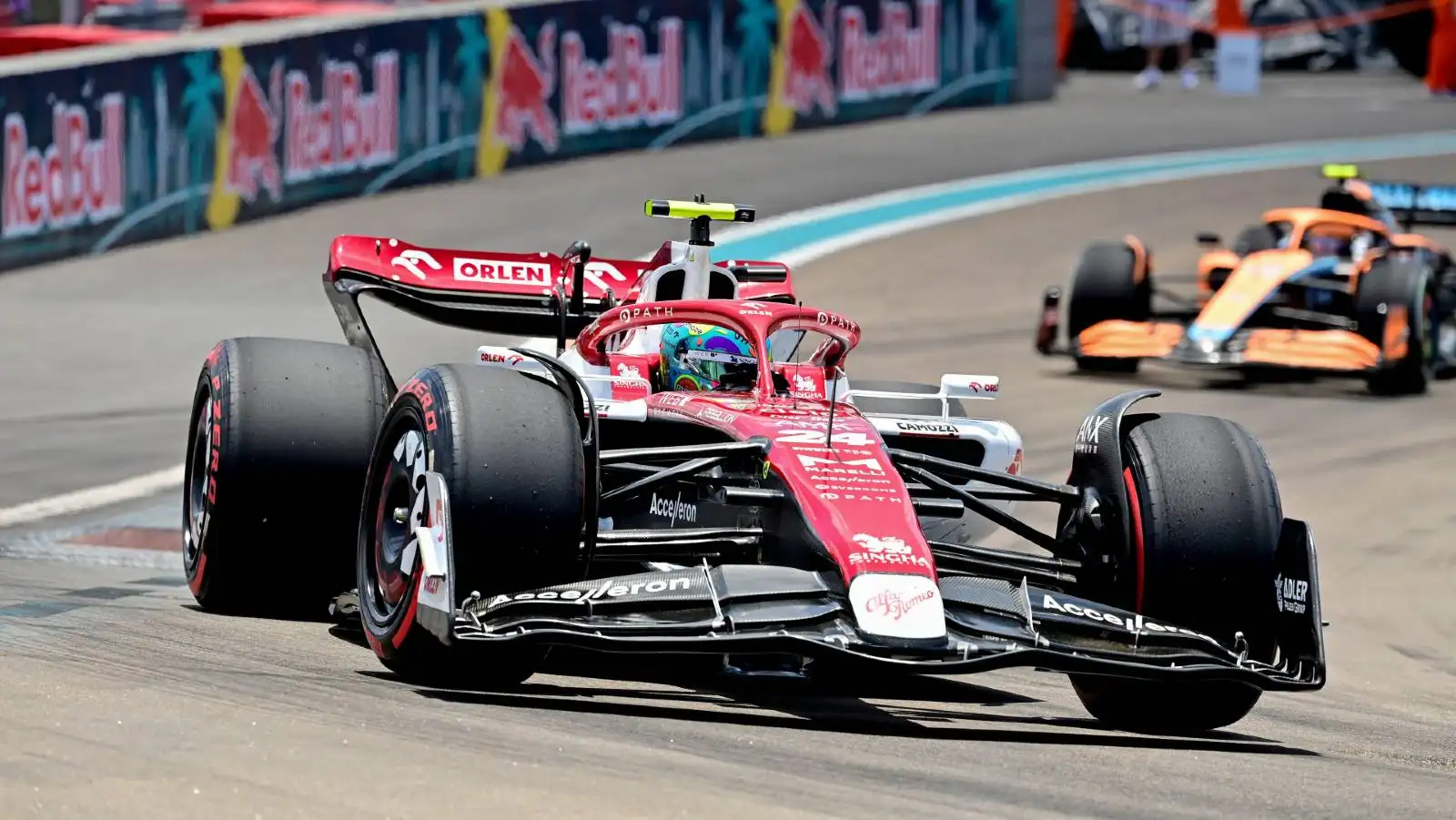 Zhou Guanyu ahead of a McLaren. Miami May 2022.