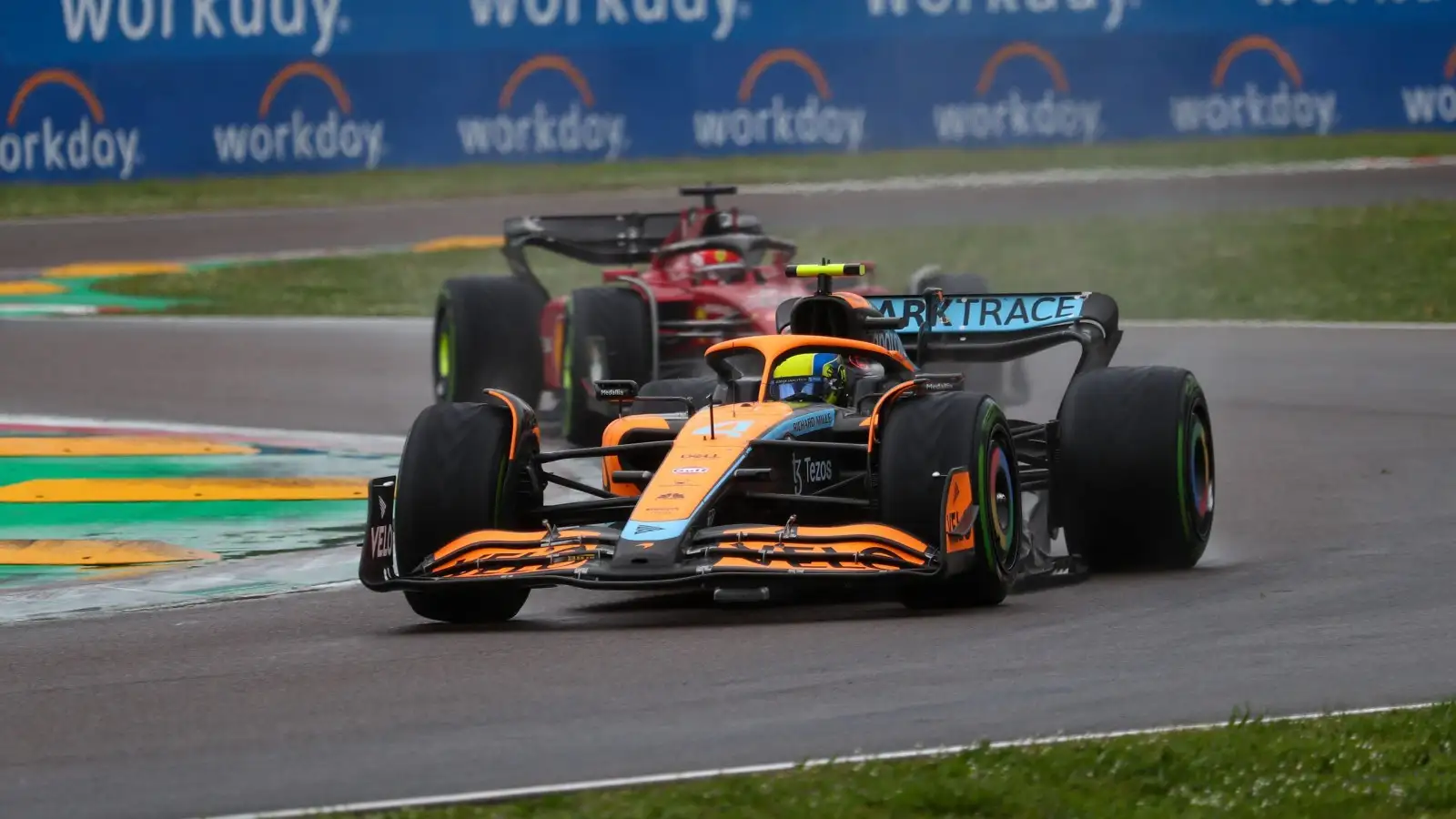 Lando Norris, McLaren, followed by Charles Leclerc, Ferrari. Italy, April 2022.