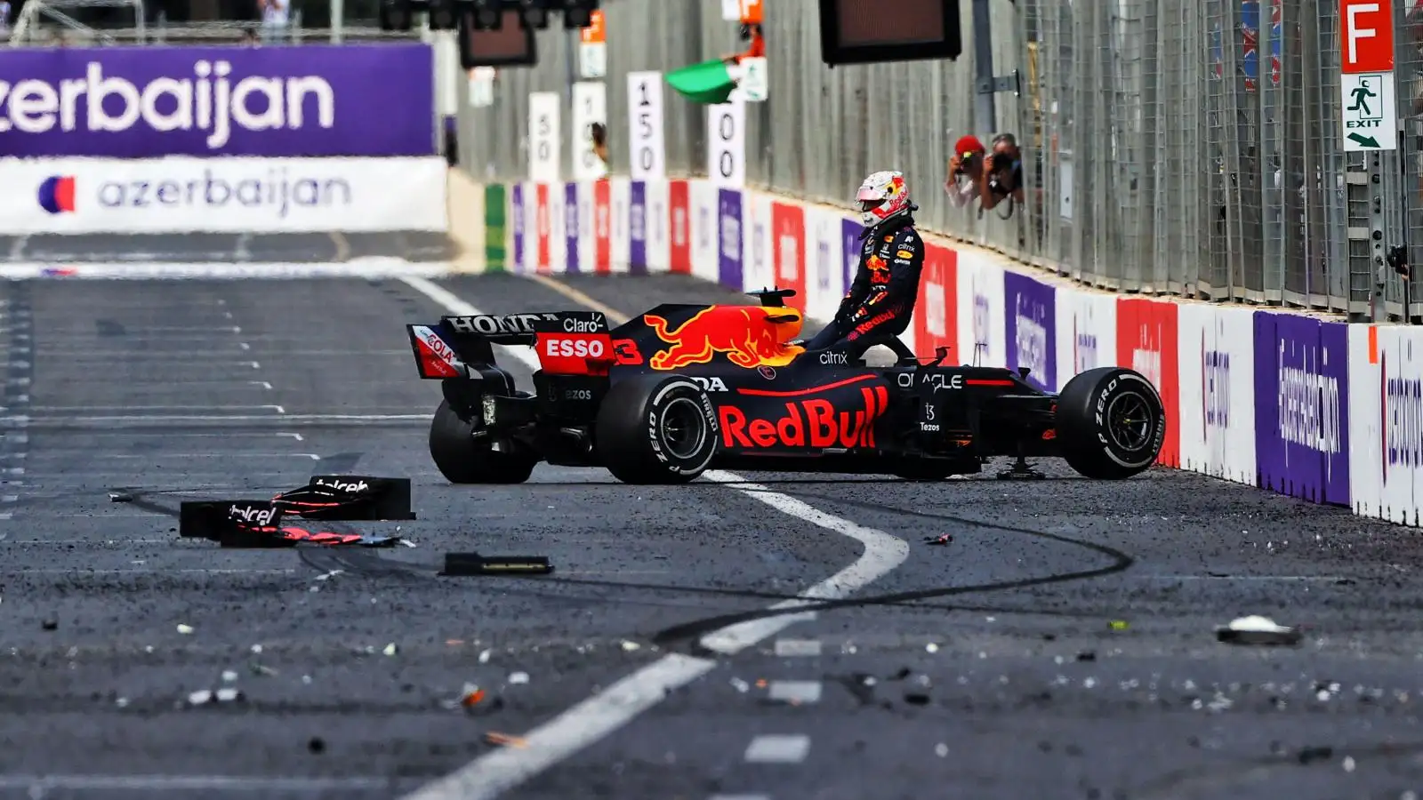 Max Verstappen sits on top of his crashed Red Bull. Baku, June 2021.