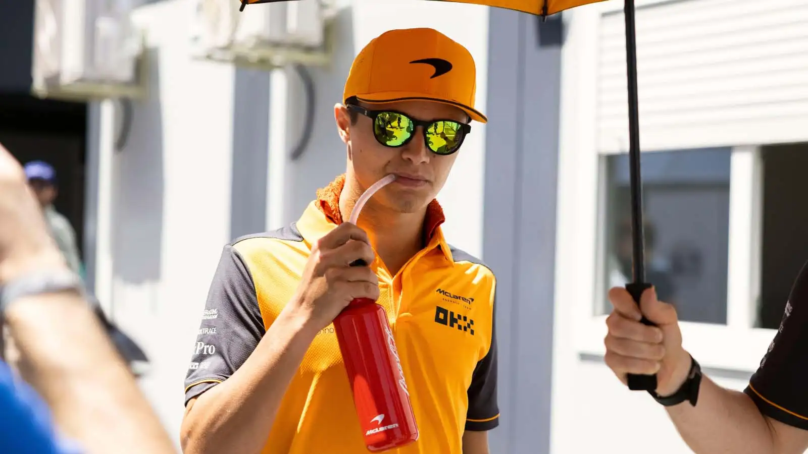 Lando Norris takes a drink. Barcelona May 2022.