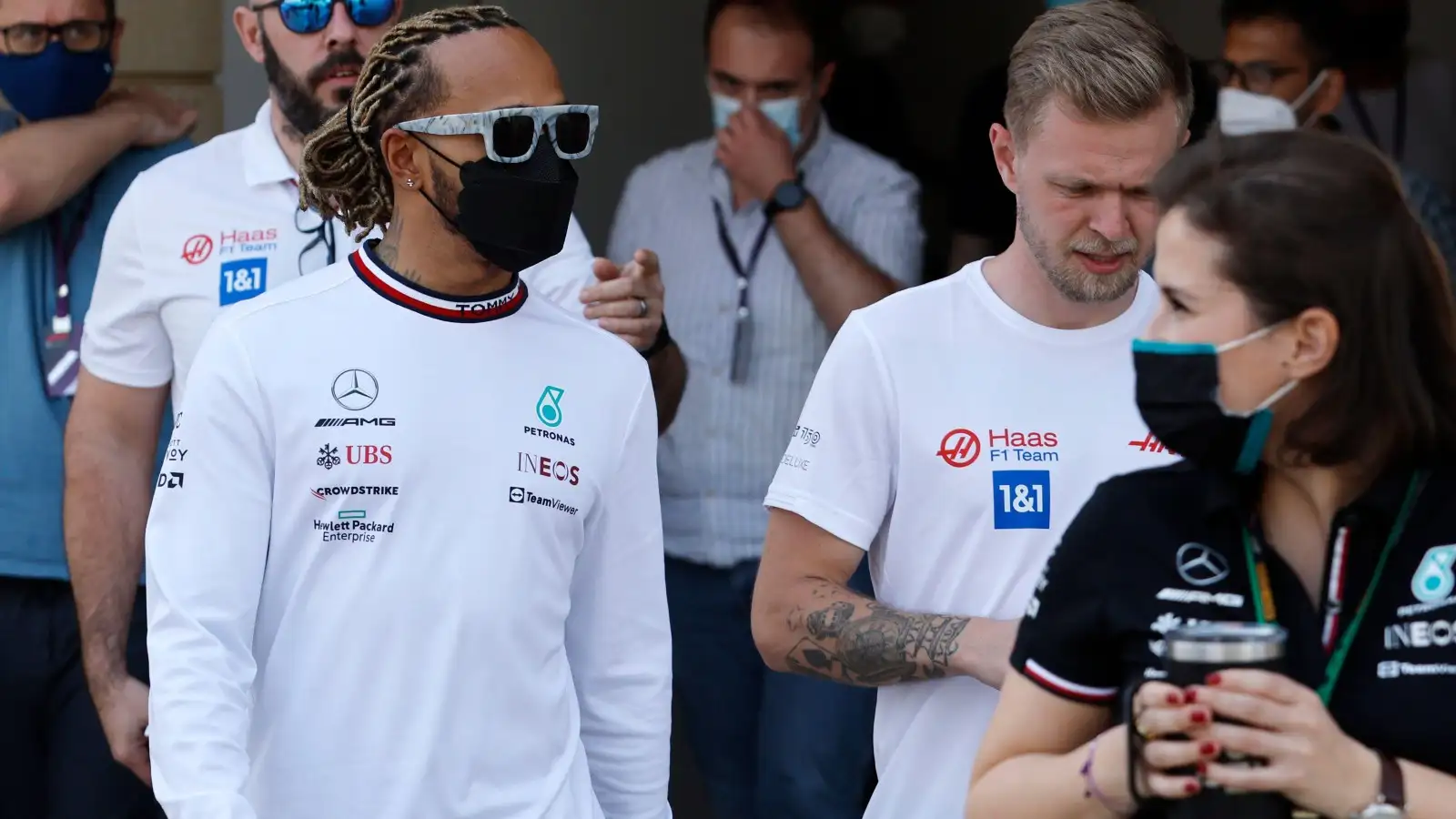 Lewis Hamilton, Mercedes, and Kevin Magnussen, Haas, walk together. Bahrain, March 2022.